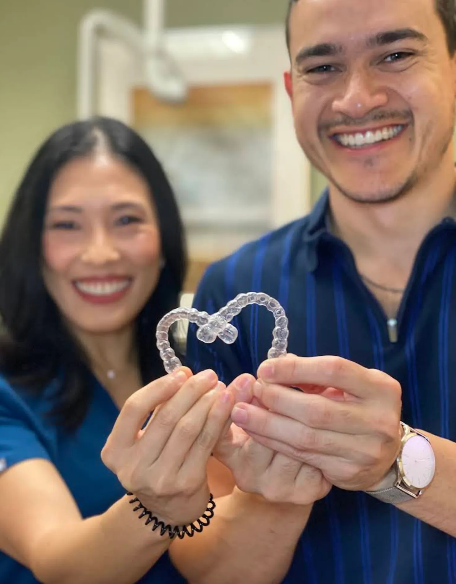 A+ Family Dentistry team members showing clear aligners